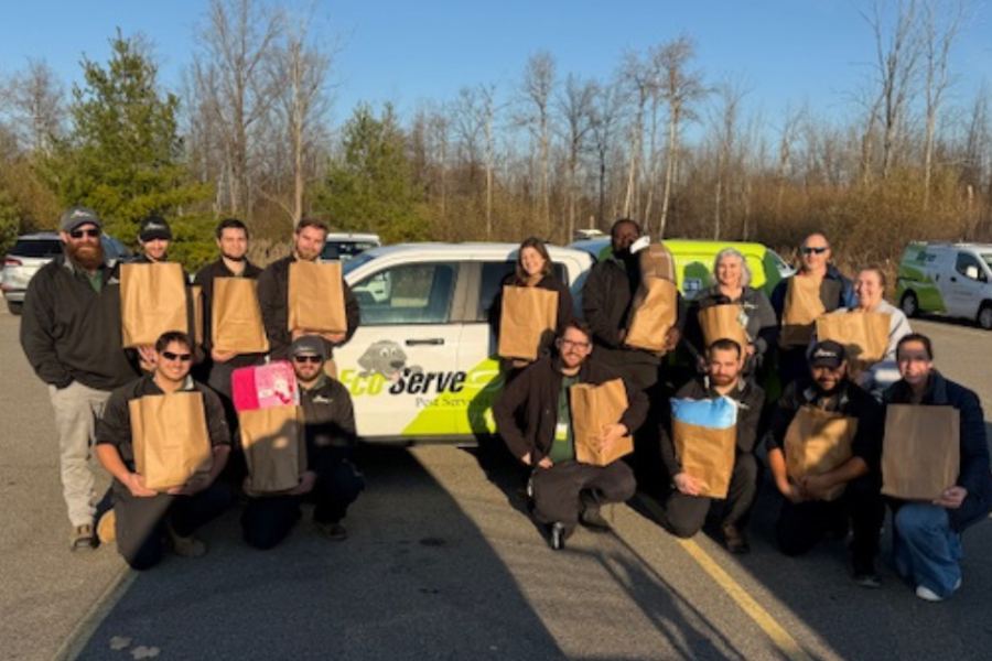 Team members wrapping and organizing gifts for distribution 