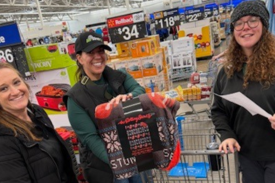 Eco Serve team selecting gifts for Compeer of Buffalo’s Winter Wonderland celebration 