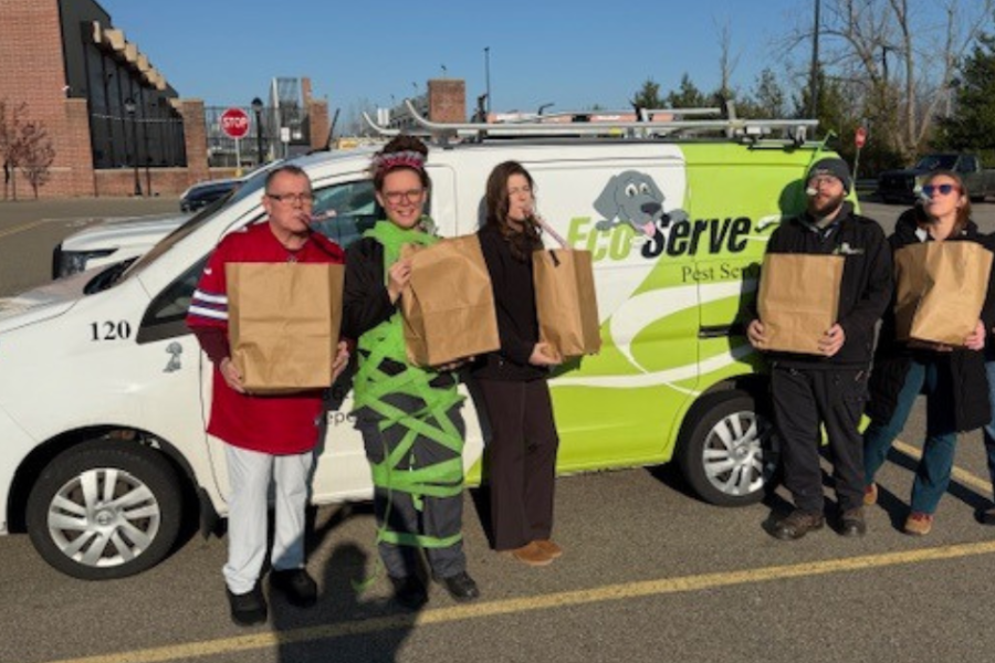 Team members wrapping and organizing gifts for distribution 