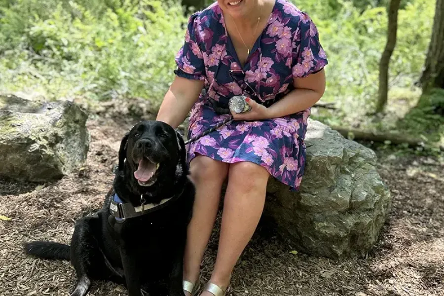 employee-posing-with-dog