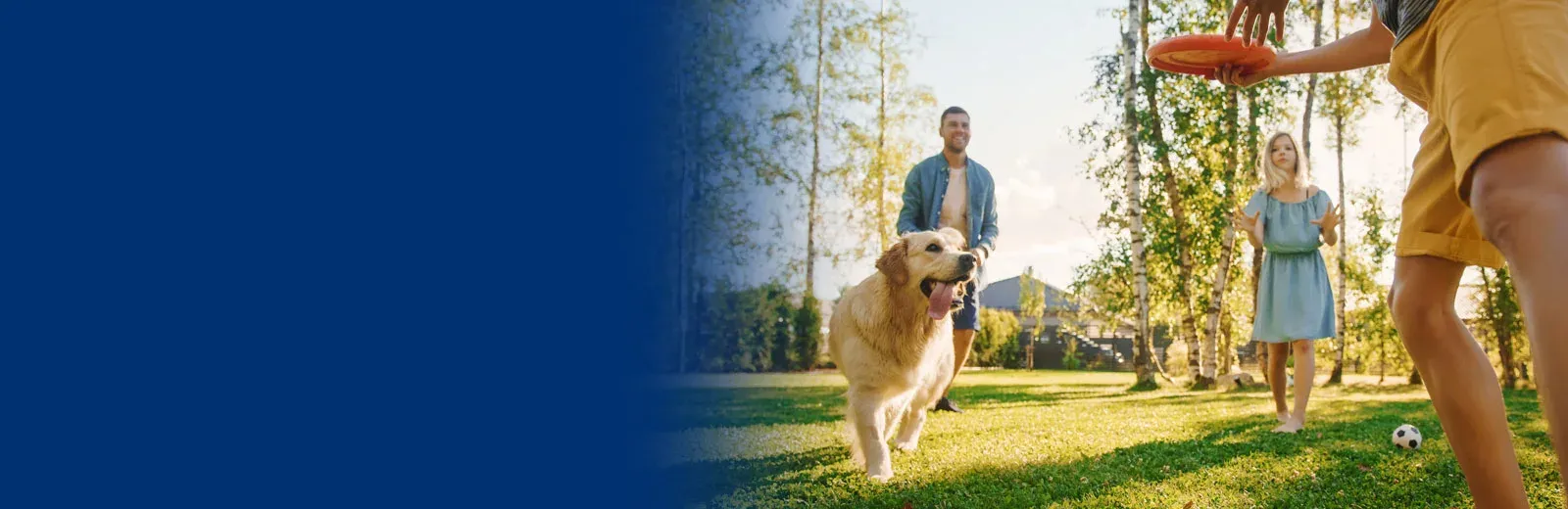 Family playing with dog outside