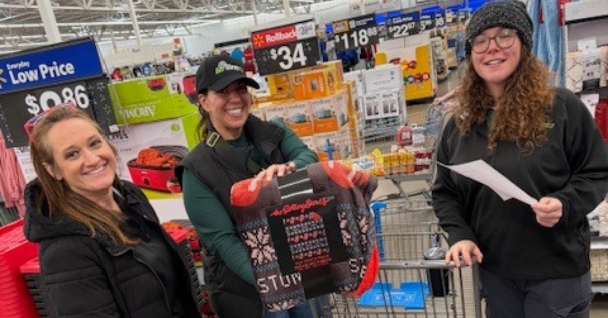 Eco Serve team selecting gifts for Compeer of Buffalo’s Winter Wonderland celebration 